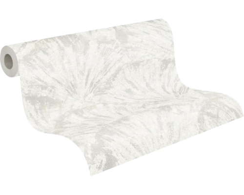 Nonwoven-tapet med abstrakt bladmotiv i ljusa toner, lätt strukturerad.