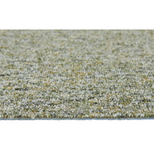 Närbild på texturen av en melerad matta med kort lugg i grönt och beige.
