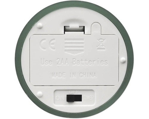Undersidan av en elektronisk enhet med batterifack för två AA-batterier, strömbrytare för På, Av och Timer samt CE-märkning.