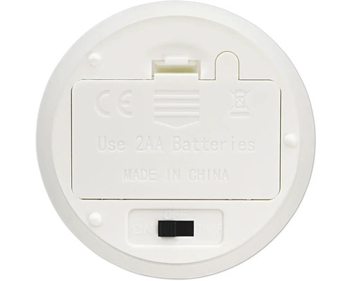 Undersidan av en vit elektronisk enhet med batterifack för två AA batterier och en brytare för på, av och timerfunktion.