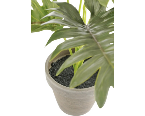 Konstgjord Philodendron-växt i stenkruka