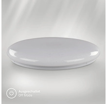 Rund, platt LED-taklampa med stjärneffekt i avstängt läge.