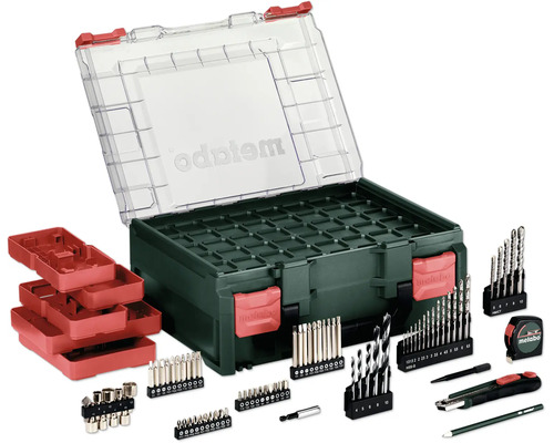 Metabo tillbehörsset med bits, borrar, måttband, brytbladskniv och penna i en plastlåda med genomskinligt lock.