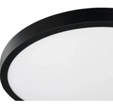 Rund LED-taklampa med svart kant och vit diffusor med stjärneffekt.