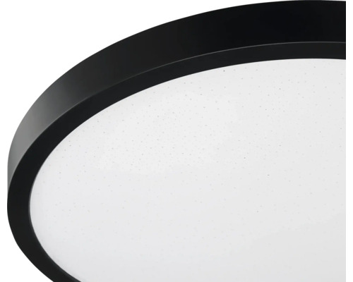 Rund LED-taklampa med svart kant och vit diffusor med stjärneffekt.
