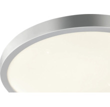 LED-taklampa med rund metallram och stjärneffekt.