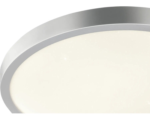 LED-taklampa med rund metallram och stjärneffekt.