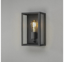 Rektangulär vägglampa med svart ram, glasrutor och en dekorativ ljuskälla.