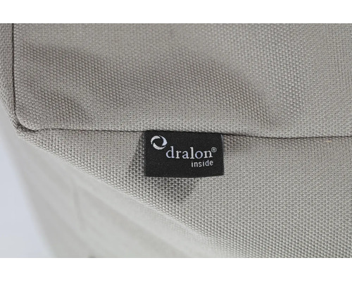 Detaljbild av en textilväv med en Dralon Logo etikett.