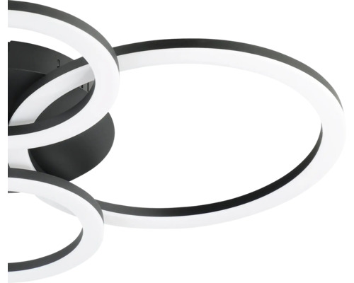 Modern LED-taklampa i svart med sammanflätade ringformade element.