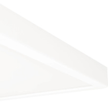 Detaljvy av hörnet på en vit, platt panel för takmontering.