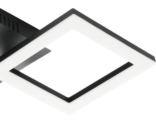 Detalj av en modern kvadratisk LED-taklampa med svart ram och vit diffusor.