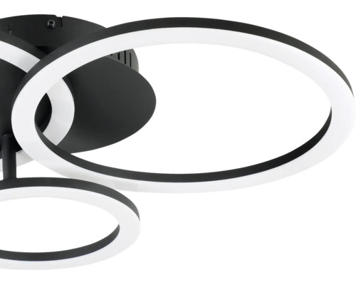 Modern LED-taklampa i svart och vitt med överlappande ringar av metall och plast.