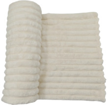 Mjuk pläd med ribbad struktur i fluffigt textilmaterial
