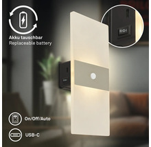 Modern LED vägglampa med rörelsesensor, utbytbart batteri, USB C anslutning och på av auto strömbrytare för inomhusbruk.