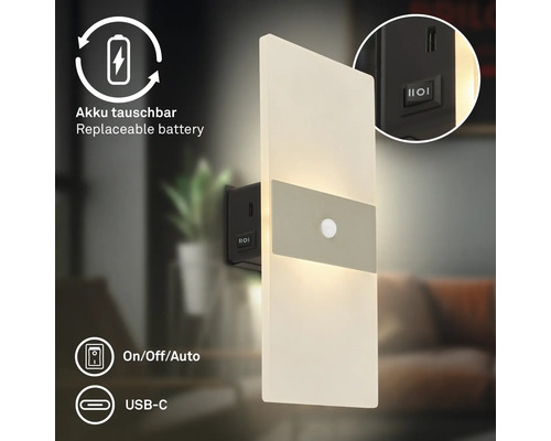 Modern LED vägglampa med rörelsesensor, utbytbart batteri, USB C anslutning och på av auto strömbrytare för inomhusbruk.