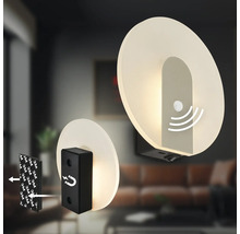 LED vägglampa med rörelsesensor och magnetfäste för väggmontering i ett modernt vardagsrum