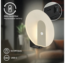 Rund LED vägglampa med rörelsedetektor, utbytbart batteri, USB C laddningsport och på av auto strömbrytare.