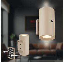 Cylindrisk LED vägglampa för limmontering med inbyggd strömbrytare, avsedd för inomhusbruk.