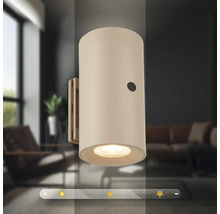 Cylindrisk vägglampa för inomhusbruk med integrerad dimmer för justerbar ljusstyrka.