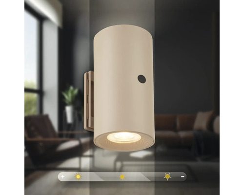 Cylindrisk vägglampa för inomhusbruk med integrerad dimmer för justerbar ljusstyrka.