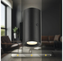 Cylindrisk LED vägglampa med dimfunktion i en modern inredning