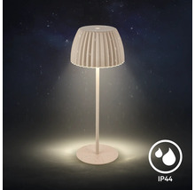 Modern utomhusbordslampa med veckad lampskärm och IP44 skydd mot vattenstänk under natten