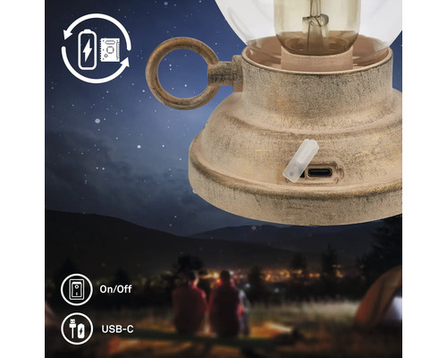 Uppladdningsbar vintage campinglykta med USB C port och av på knapp i en nattlig naturmiljö