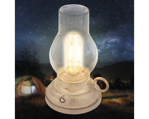 Dekorativ LED lykta i antik design med glaskupa och glödtrådslampa för stämningsfull belysning.