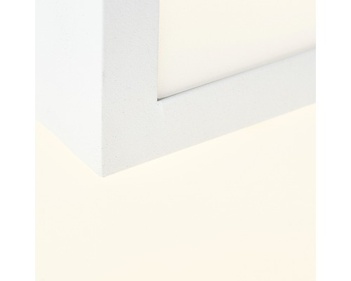 Detaljvy av ett hörn av en vit lampa