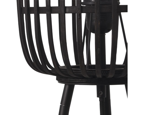 Närbild av en mörk golvlampa med korg