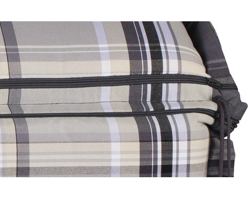 Detaljvy av en sittsäck med dragkedja och rutmönster