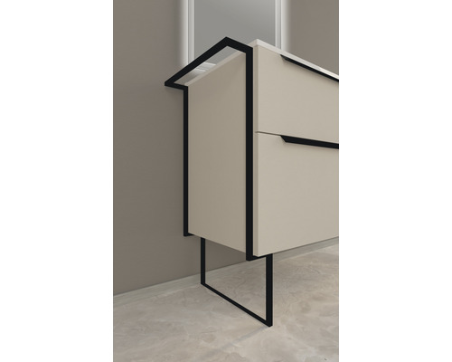 Detaljbild av ett badrumsskåp med lådor och en ram