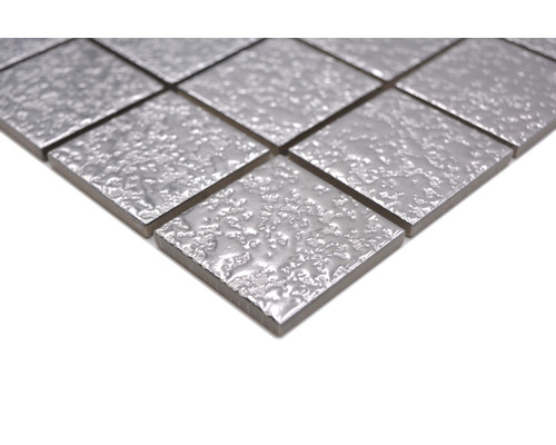 Mosaikplatta med texturerad yta