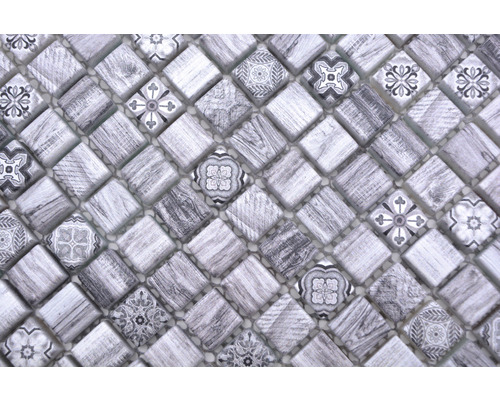 Mosaikplatta med kvadratiska element och olika mönster