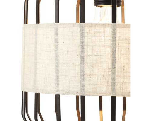 Detaljvy av en lampa med tygskärm och metallram
