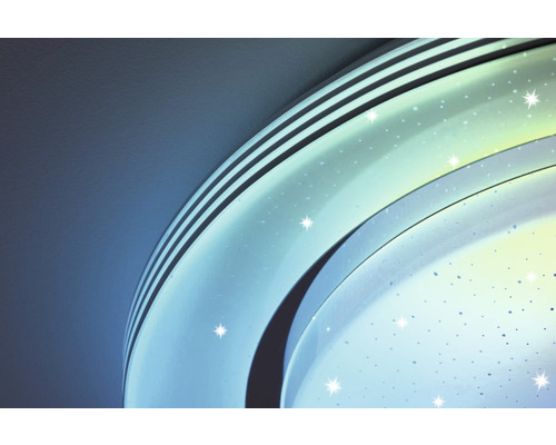 Närbild av en taklampa med stjärnmönster