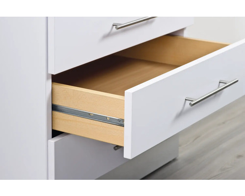 Vit lådskåp med en öppen låda.