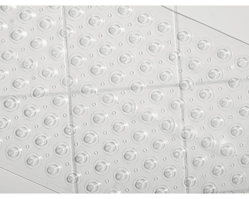 Detaljvy av en transparent badkarsmatta med sugproppar