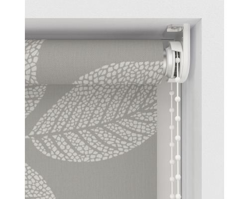 Detaljvy av en rullgardin med bladmönster och kedjedrag