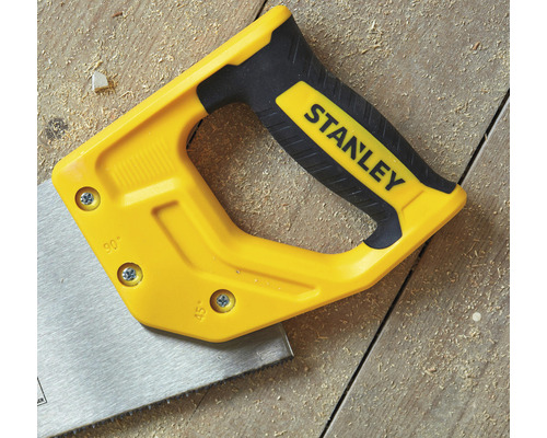 Handsåg med Stanley logotyp på träbakgrund