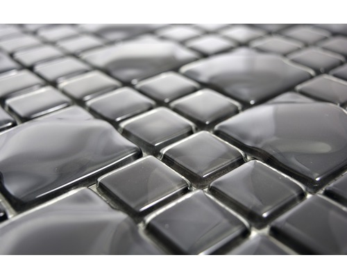 Närbild av svarta mosaikplattor