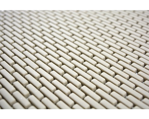 Detaljvy av en duschmatta med rektangulära element.