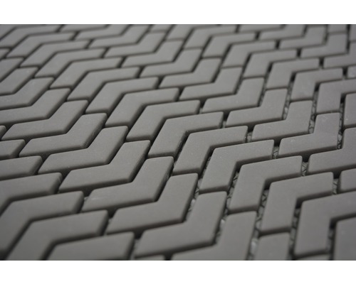 Detaljvy av ett mosaikmönster i form av en pil