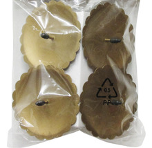 Fyra möbelglidare med blomkant i en förpackning