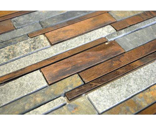 Närbild av väggplattor av sten och metall