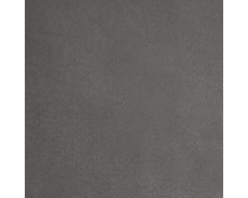 Närbild av ett grått tyg med prickigt mönster