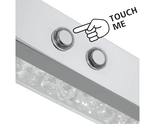 "Detaljvy av en lampa med beröringssensor och texten ""Rör mig"""