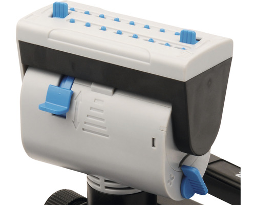 Detaljvy av en gödselspridare med inställningar för att justera spridningsmängden