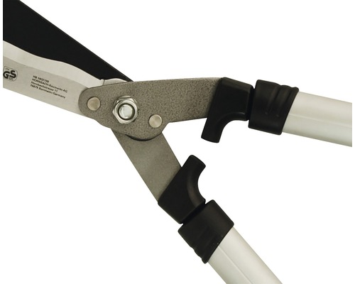 Detaljvy av en häcksax med grå metallblad och vita handtag